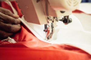 Industrial sewing machine stitching a custom duffel bag in Dubai Industrial sewing machine stitching a custom duffel bag in Dubai