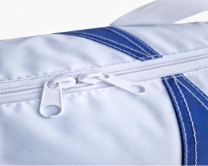 Close-up of a customised bag zipper showing metal teeth and reinforced stitching
